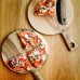 Set of wooden plate and pizza cutter